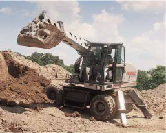 Gradall excavator moving dirt